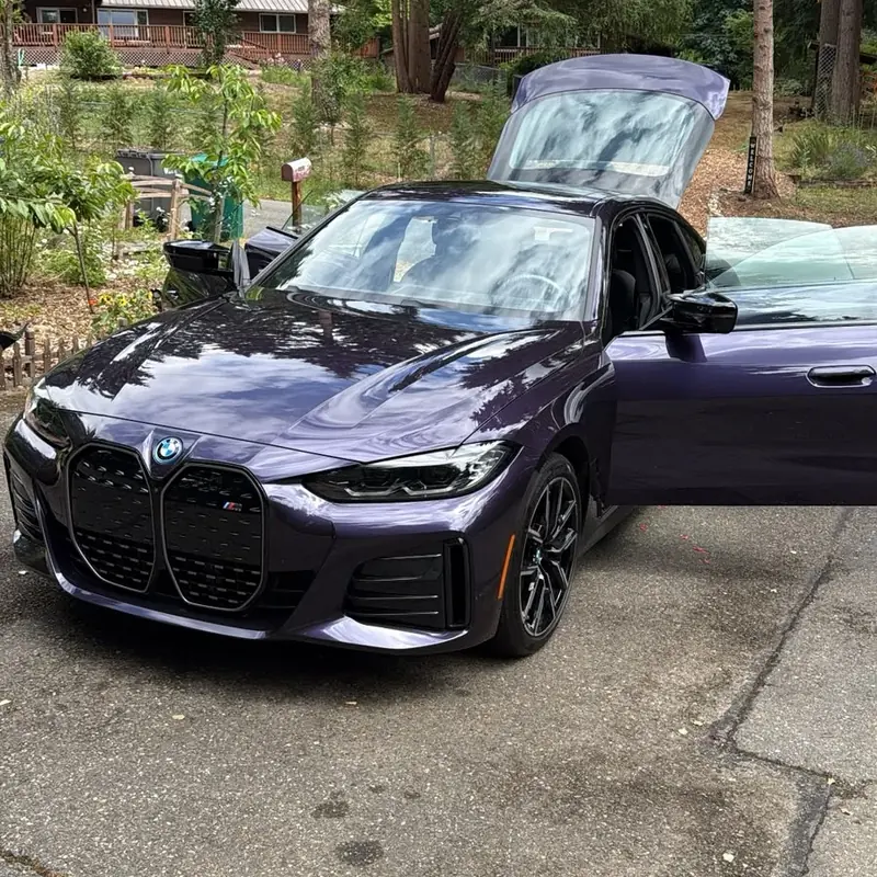 BMW coupe with a reflective exterior finish after detailing